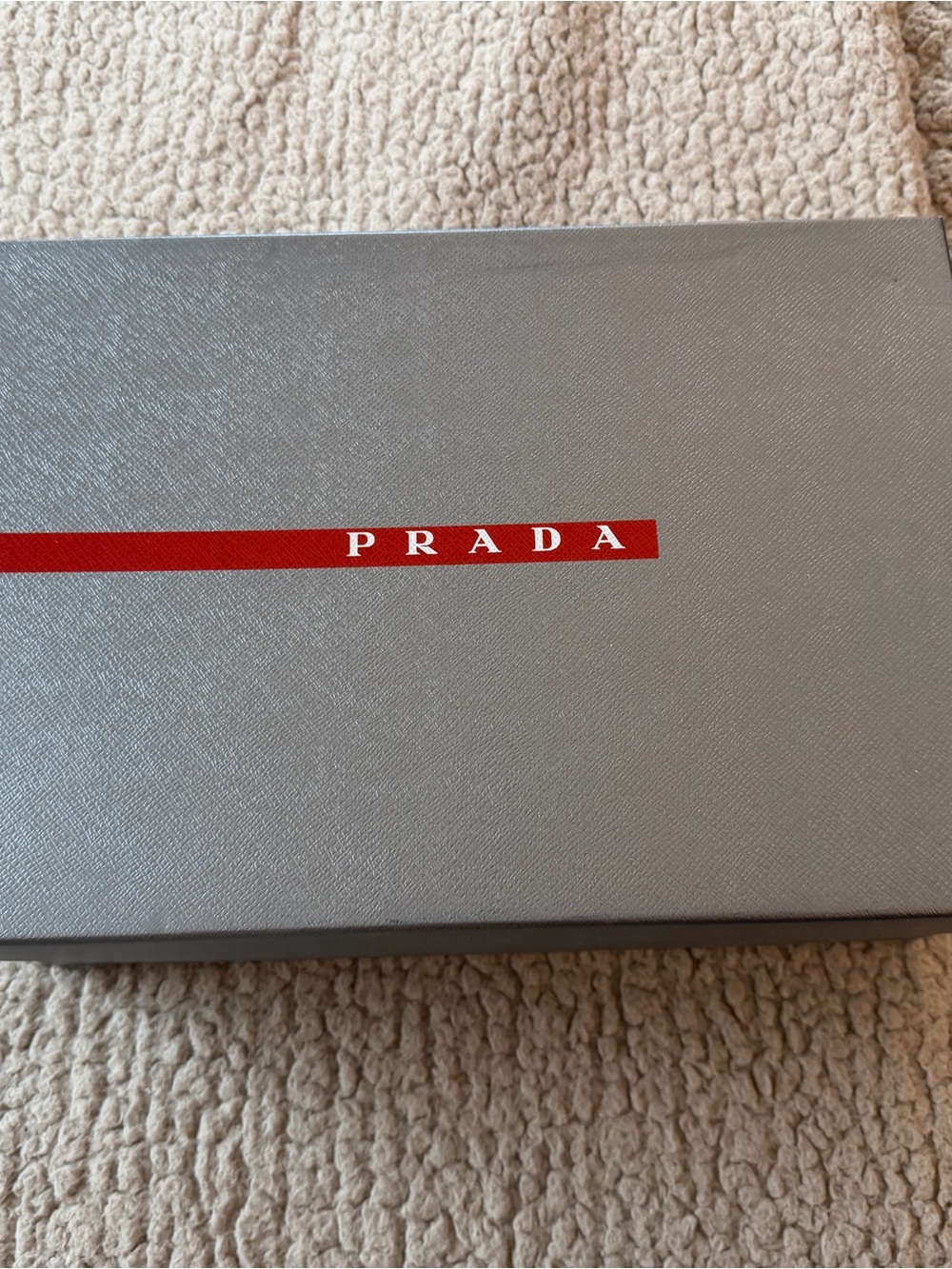 Prada Gray Box with Red Logo Strip
